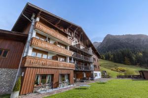 a building with balconies on the side of it at IFA Breitach Apartments Kleinwalsertal in Mittelberg