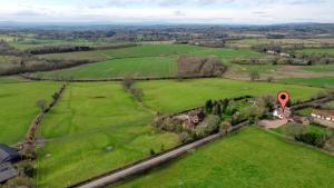 an aerial view of a green field with a red marker at Fairview Cottage - Luxury Cottage with Hot Tub & Pizza Oven in Alvechurch