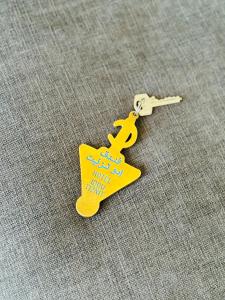 a yellow keychain with a happy new year written on it at Hotel Idou Tiznit in Tiznit