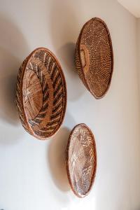 three copper coins sitting on a white table at Soutelande Eco-Hideaway - 2min Drive to Pristine Beach in Port Elizabeth