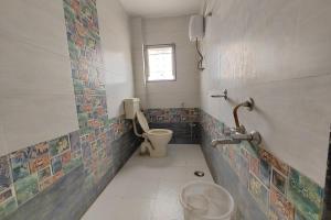 Bathroom sa Vaishnav Inn