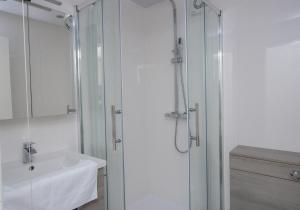 a bathroom with a shower and a sink at Chalet 137 in Deal +11 photos