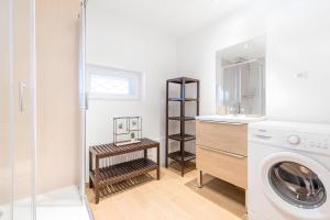 a bathroom with a sink and a washing machine at Studio Family Marseille Parking Clim - MaisonMars in Marseille