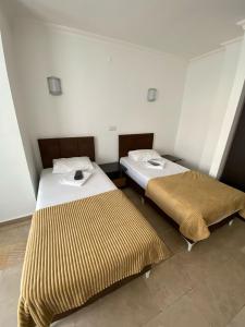 A bed or beds in a room at Alanya Central Apartments