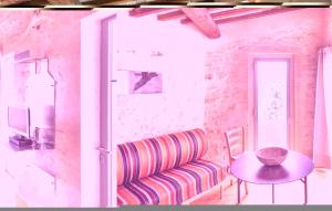 a room with a couch and a table and a window at Sanlucchese 3 in Poggibonsi