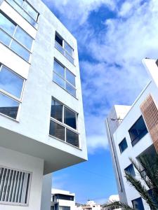 a white building with the sky in the background at Blissapartments T2 - Simone (nearby the beach) in Mindelo