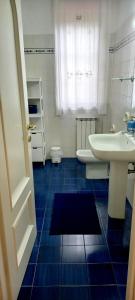 a bathroom with a sink and a toilet at Il Parco holiday - locazione turistica in Fonte Nuova