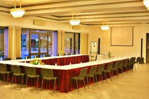 a large meeting room with a long table and chairs at Hotel Mamora Kénitra in Kenitra