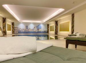 a bedroom with a view of a pool at Courtyard by Marriott Hamburg Airport in Hamburg
