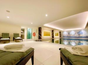 a room with two beds and a pool at Courtyard by Marriott Hamburg Airport in Hamburg