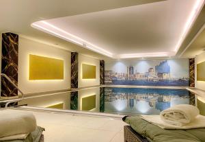 a swimming pool mural in a hotel room at Courtyard by Marriott Hamburg Airport in Hamburg