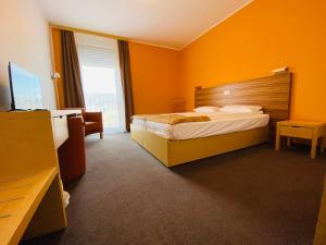 Ένα ή περισσότερα κρεβάτια σε δωμάτιο στο Hotel Veter