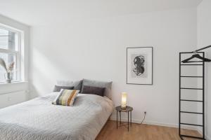 Ένα ή περισσότερα κρεβάτια σε δωμάτιο στο Luksus Bolig til 6 Personer i Hjertet af Aarhus