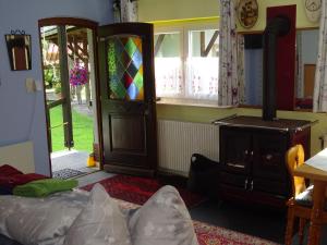 a room with a wood stove and a door at Ferienhaus-Römerthurm in Schöder