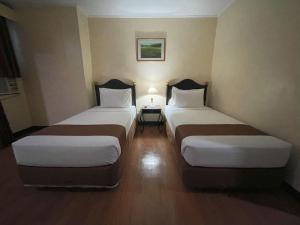 Postel nebo postele na pokoji v ubytování Golden Peak Hotel & Suites powered by Cocotel