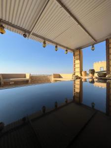 a view of a swimming pool with a roof at Hostel Desert Home Stay in Jaisalmer