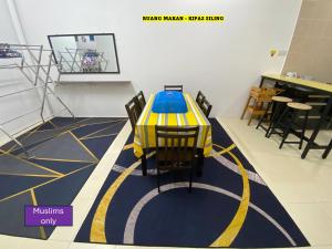 a toy car on a floor in a room at Homestay Cikgu Ahmed Batu Kikir in Batu Kikir