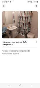 a bathroom with a toilet and a shower curtain at vip huertos familiares in San Pedro de la Paz