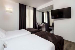 En eller flere senger på et rom på Best Western Hotel Biri