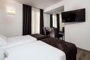 Postel nebo postele na pokoji v ubytování Best Western Hotel Biri