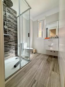 a bathroom with a glass shower and a toilet at Villa Buenavistas in Adeje