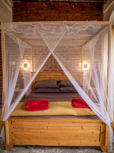 a bed with mosquito netting over it in a room at Firefly Boutique Lodge in Bagamoyo