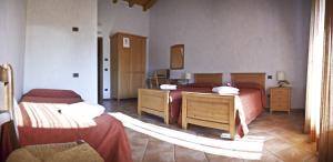 Postel nebo postele na pokoji v ubytování Agriturismo Ai Casoni + 12 fotografií