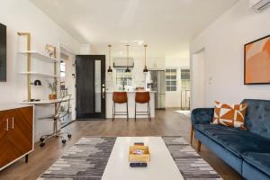 a living room with a couch and a table at Downtown Culver City New Designer Lux 1 Bedroom in Los Angeles