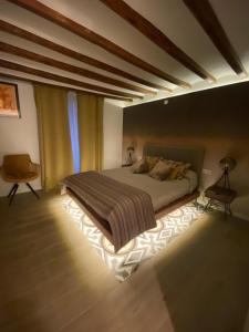 a bedroom with a large bed in a room at Casa Hermes in Villajoyosa