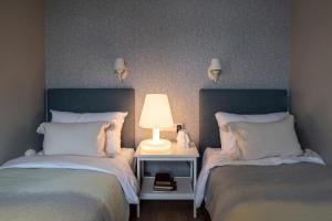 Postel nebo postele na pokoji v ubytování Aparthotel Amella