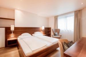 Voodi või voodid majutusasutuse Seehotel Restaurant Lackner toas