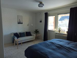 Postel nebo postele na pokoji v ubytování SunnemosLantLiv