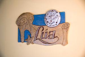 a sign on a wall with an animal on it at Hotel Rural Casona Trabadelo in Vegadeo