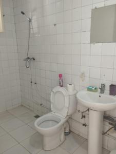 a bathroom with a toilet and a sink at Studio centre ville Agadir in Agadir