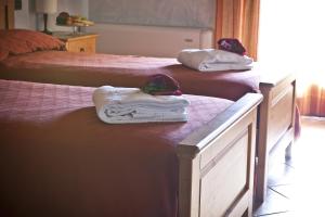 Postel nebo postele na pokoji v ubytování Agriturismo Ai Casoni
