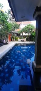 a swimming pool with blue water in a building at Best Choice Nusa Lembongan in Nusa Lembongan