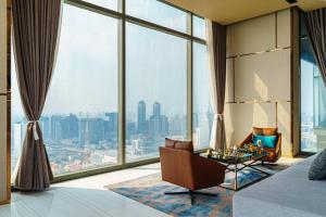a living room with a view of a city at Luxury 2 Bedrooms Condo Checkin 24h Infinity Pool 360 in Bangkok