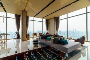 a living room with a couch and a pool table at Luxury 2 Bedrooms Condo Checkin 24h Infinity Pool 360 in Bangkok