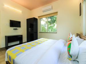 Giường trong phòng chung tại Elite And Modern Stay