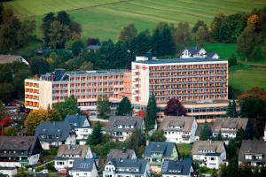 a large building in a town with houses at Hotel Hochsauerland 2010 in Willingen