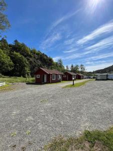 a group of houses in a parking lot at Svindland Camping in Kvinesdal