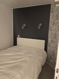 Postel nebo postele na pokoji v ubytování Le Motu + 9 fotografií