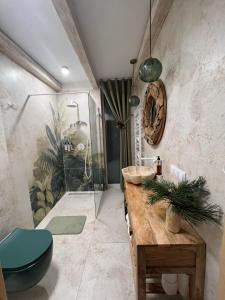 a bathroom with a shower and a toilet and a sink at Czaple Resort in Stare Czaple