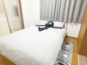 Postel nebo postele na pokoji v ubytování 池袋2分5人可