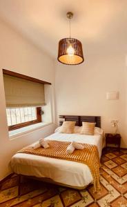 Hotel 3* La Casona de las Flores房間的床