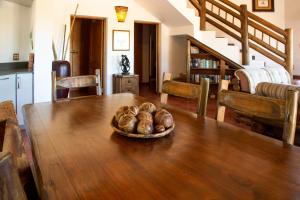 a bowl of mushrooms on a wooden table in a living room at Sondela Nature Reserve & Spa Makhato Lodges in Bela-Bela