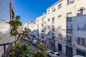 a view of a city street with buildings at Mouraria Doll's House in Lisbon