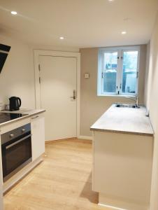 a kitchen with a sink and a counter top at (id115) Nørregade 51 kl in Esbjerg
