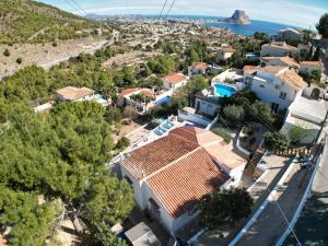 an aerial view of a house with a view of the ocean at Villa Marisol in Calpe