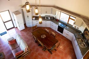 an overhead view of a kitchen with a table and a couch at Sondela Nature Reserve & Spa Makhato Lodges in Bela-Bela